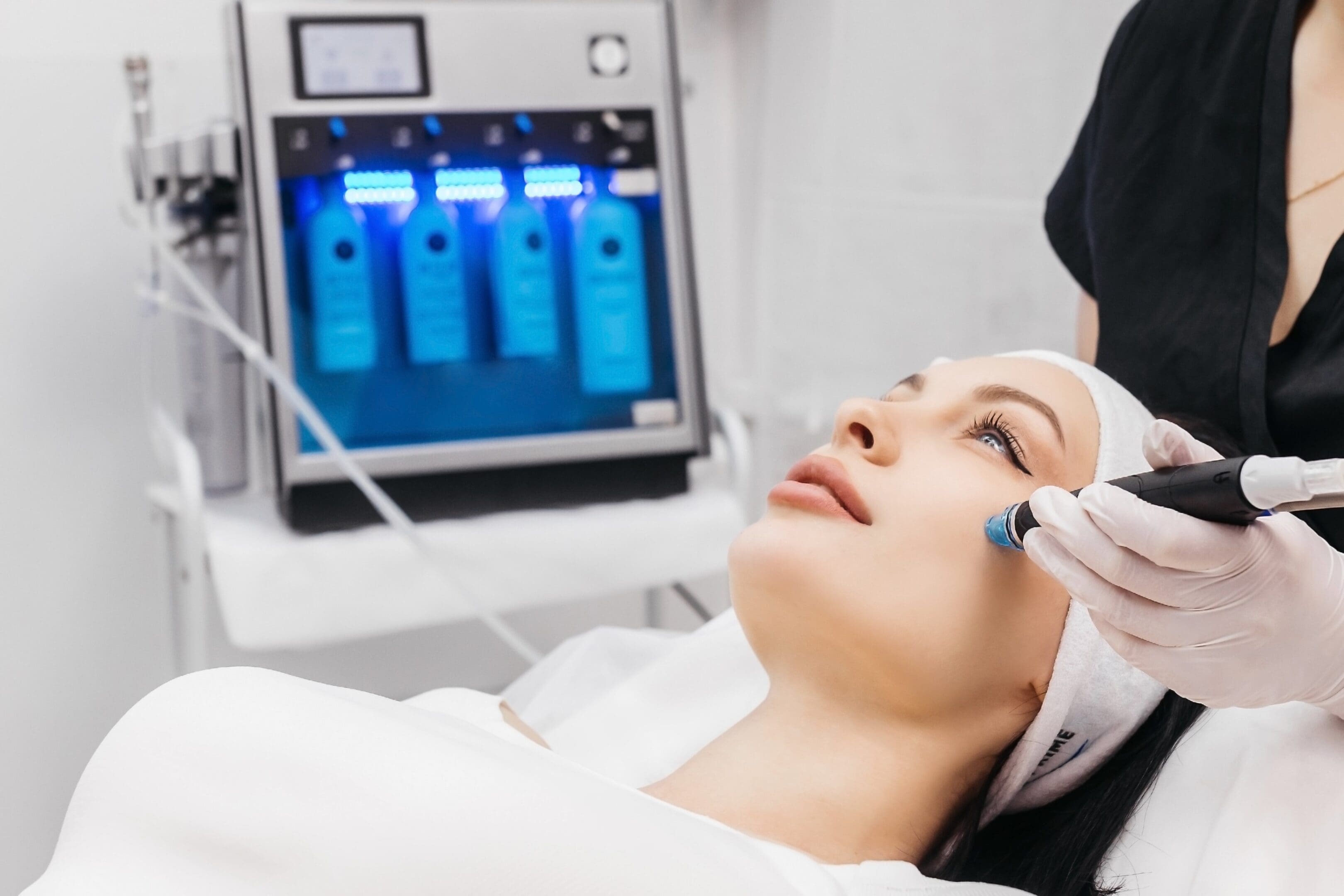 1593A8CE-0DEF-4C2B-91C2-07743A5BC533 A woman getting her face cleaned by an esthetician.