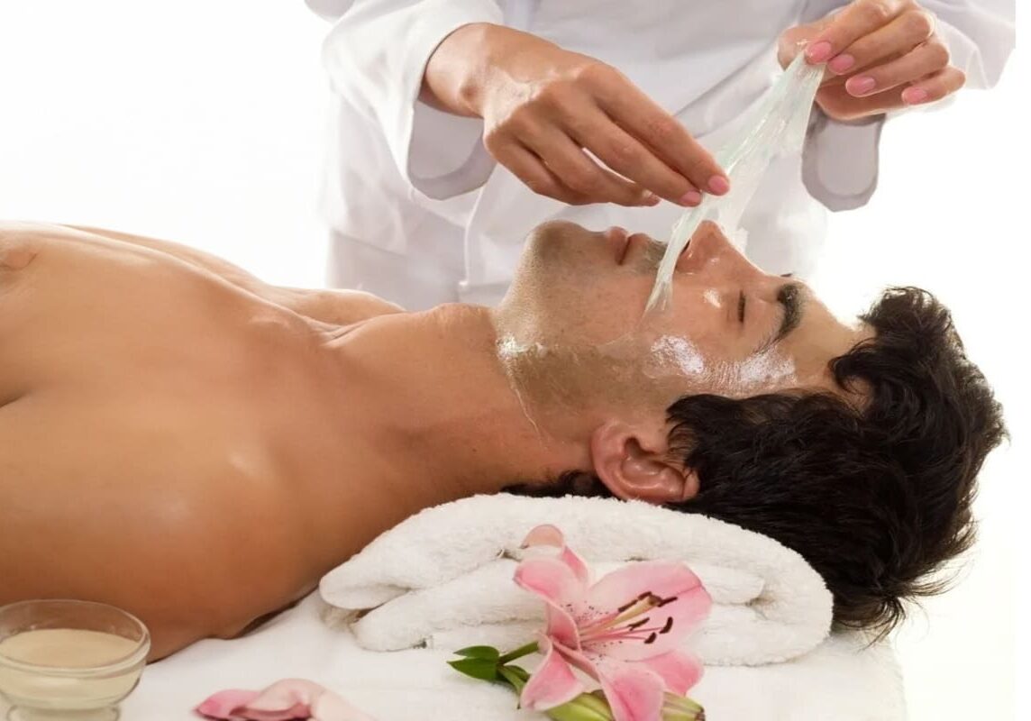 A man getting his face washed with soap.